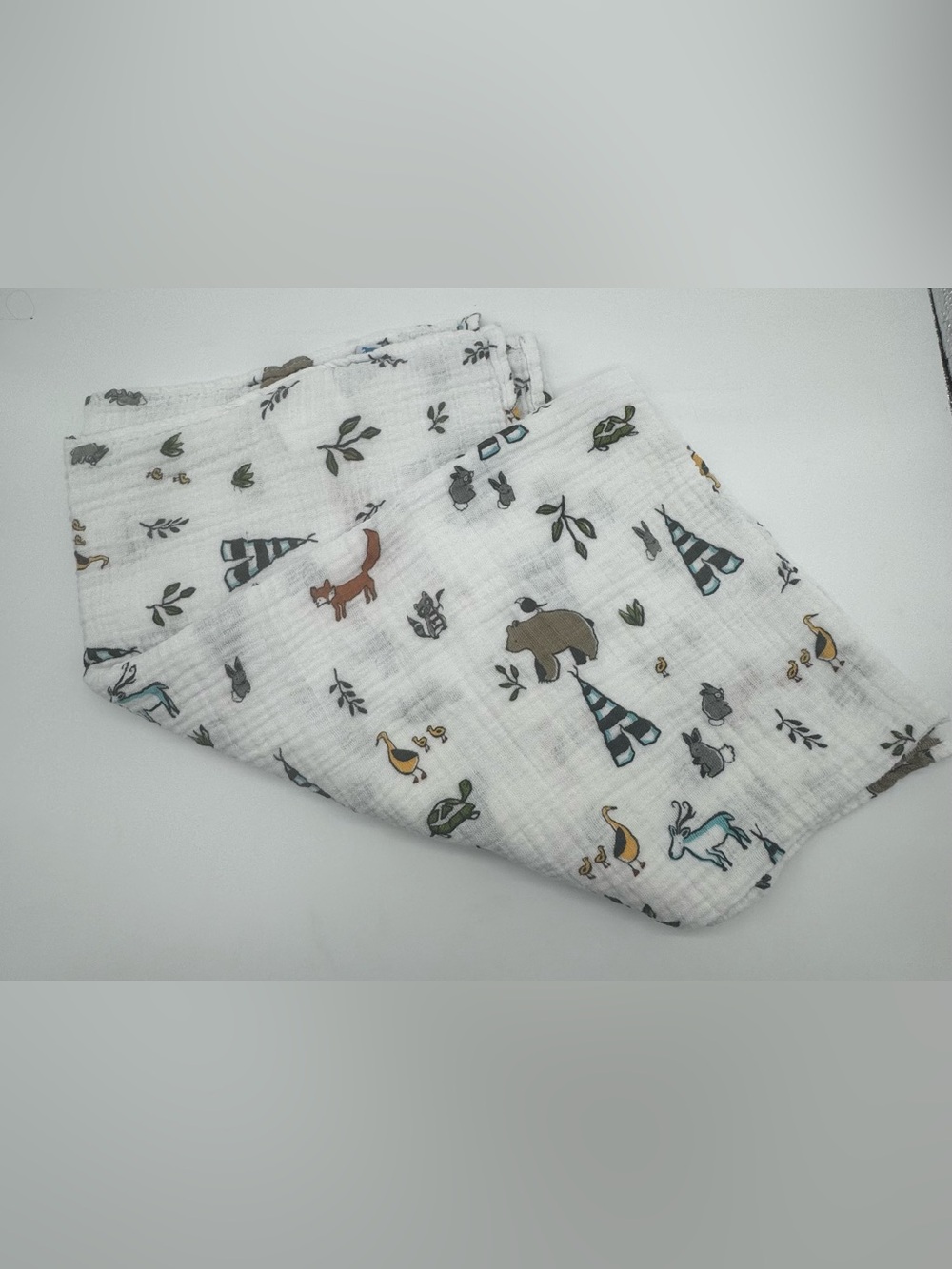 Little Unicorn Muslin Swaddle Blanket featuring Forest Friends Print